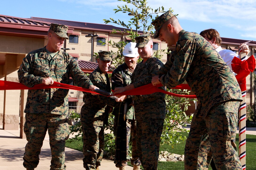 (Left to right) Sgt. Maj. Jeffrey H. Dixon, sergeant major, Marine Corps Installations West, Col. Nicolas F. Marano, commanding officer, Marine Corps Base Camp Pendleton, Navy Capt. Joseph A. Campbell, officer in charge of construction, MCI-West, Lt. Col. Scott Leonard, commanding officer, 1st Light Armored Reconnaissance Battalion and 2nd Lt. Christopher M. Phifer, platoon commander, 3rd Platoon, Bravo Company, 1st LAR, cut a ribbon to officially open new state-of-the-art bachelors enlisted quarters at Camp Las Flores, Camp Pendleton, Nov. 6.