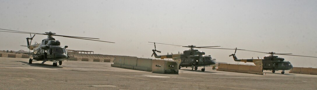 A detachment of 17 personnel from 4th Squadron, Iraqi Air Force, and their five U.S. Air Force advisors, arrive aboard Camp Al Taqaddum, Iraq, on IQAF Mi-17’s, Nov. 7, 2009.  The Iraqi Ministry of Defense directed that the detachment come to the base in order to provide a rotary wing transportation capability to the Anbar Operations Command.  (U.S. Marine Corps photograph by Lance Cpl. Melissa A. Latty)