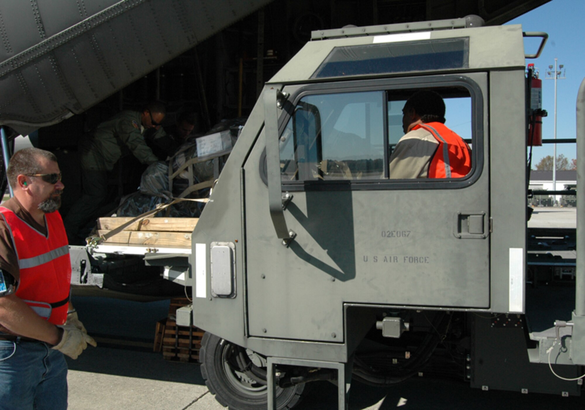 Members of the Traffic Management Office unload cargo of Airmen returning from a simulated deployment during an Operational Readiness Exercise at Dobbins Air Reserve Base Nov. 7 in preparation for an Operational Readiness Inspection scheduled for Dec. The exercise simulated a short-notice deployment and demonstrated the importance of traditional reservists being fully qualified to deploy anywhere in the world at any given time. (U.S. Air Force photo/Tech. Sgt. James Branch)