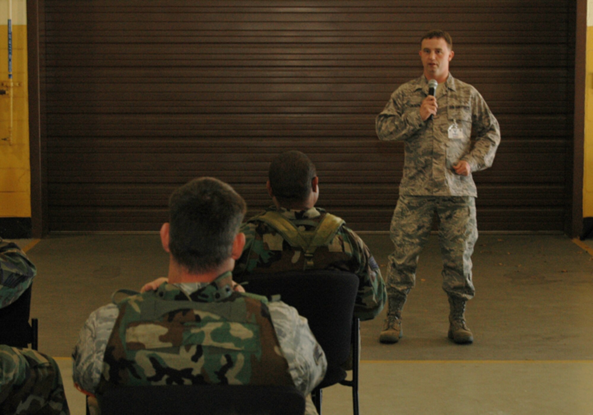 Staff Sgt. Nicholas Gilson, budget analyst, 94th Financial Management, gives a financial briefing to deploying Airman during an Operational Readiness Exercise at Dobbins Air Reserve Base Nov. 7 in preparation for an Operational Readiness Inspection scheduled for Dec. The exercise simulated a short-notice deployment and demonstrated the importance of traditional reservists being fully qualified to deploy anywhere in the world at any given time. (U.S. Air Force photo/Tech. Sgt. James Branch)