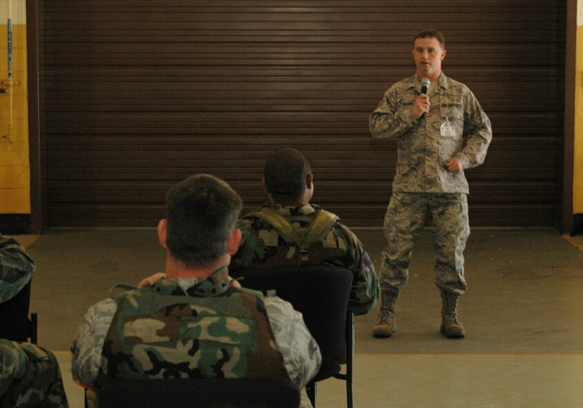 Staff Sgt. Nicholas Gilson, budget analyst, 94th Financial Management, gives a financial briefing to deploying Airman during an Operational Readiness Exercise at Dobbins Air Reserve Base Nov. 7 in preparation for an Operational Readiness Inspection scheduled for Dec. The exercise simulated a short-notice deployment and demonstrated the importance of traditional reservists being fully qualified to deploy anywhere in the world at any given time. (U.S. Air Force photo/Tech. Sgt. James Branch)