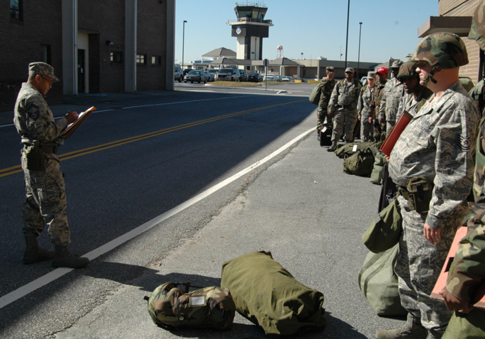 Senior Master Sgt. Kevin B. Pearson, air terminal operations center supervisor, 80th Aerial Port Squadron, accounts for deploying 80 APS Airman during an Operational Readiness Exercise at Dobbins Air Reserve Base Nov. 7 in preparation for an Operational Readiness Inspection scheduled for Dec. The exercise simulated a short-notice deployment and demonstrated the importance of traditional reservists being fully qualified to deploy anywhere in the world at any given time. (U.S. Air Force photo/Tech. Sgt. James Branch)