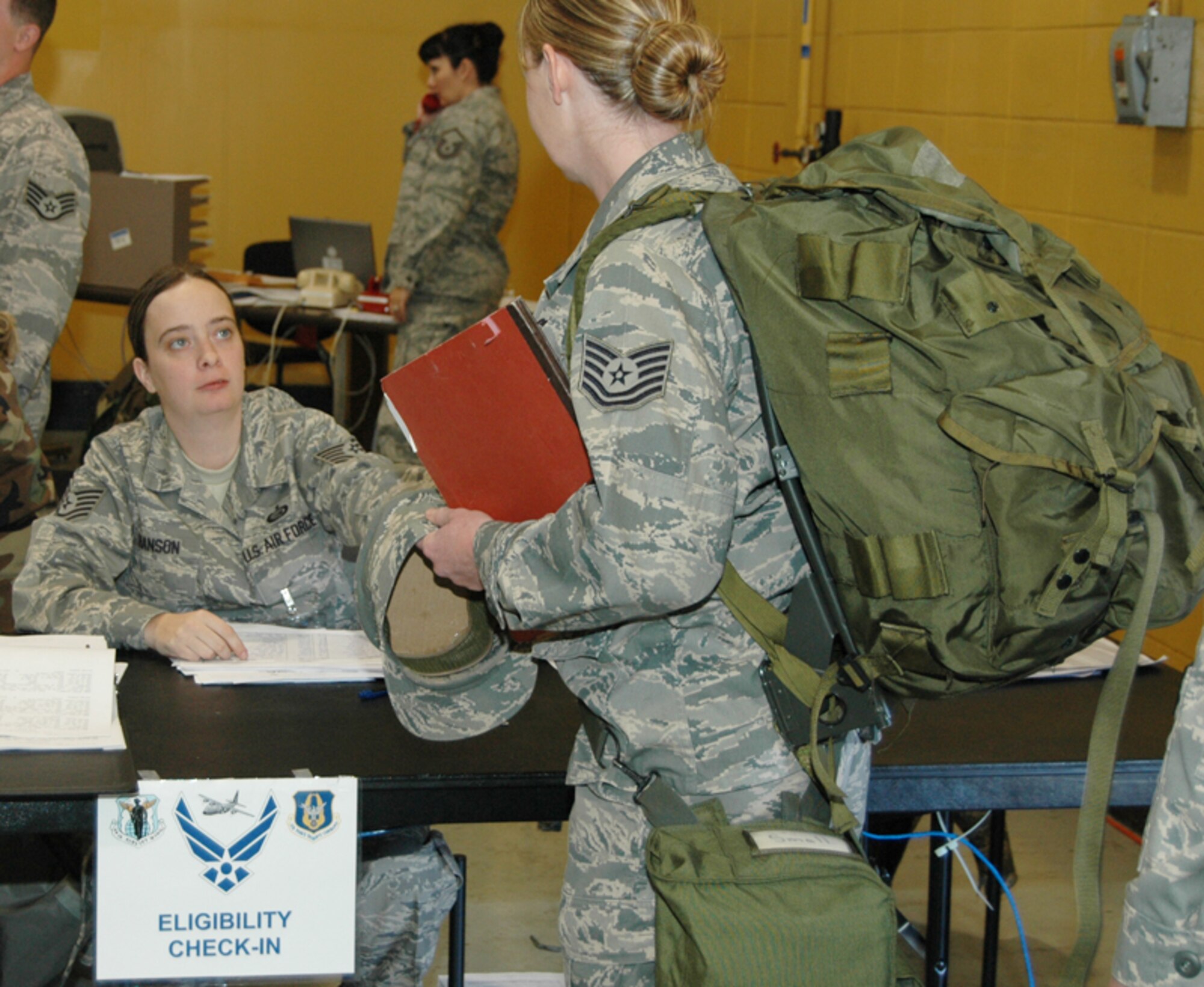 Tech. Sgt. Nicole A. Hanson, personnel specialist, 94th Mission Support Squadron, processes a deploying Airman during an Operational Readiness Exercise at Dobbins Air Reserve Base Nov. 7 in preparation for an Operational Readiness Inspection scheduled for Dec. The exercise simulated a short-notice deployment and demonstrated the importance of traditional reservists being fully qualified to deploy anywhere in the world at any given time. (U.S. Air Force photo/Tech. Sgt. James Branch)