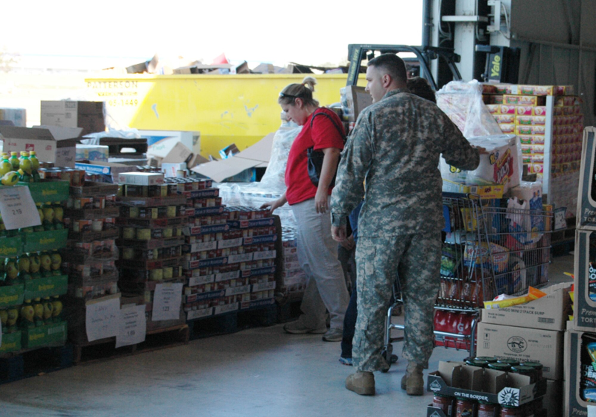Military members, retirees and dependents take advantage of savings at the case lot sale at Dobbins Air Reserve Base Nov. 7. The Defense Commissary Agency holds periodical case lot sale events, offering customers bulk quantities of their favorite products at increased savings, such as canned goods, beverages, cleaning or laundry products, meat and produce. The next case lot sale is scheduled for Feb. 5-7, 2010. (U.S. Air Force photo/Tech. Sgt. James Branch)