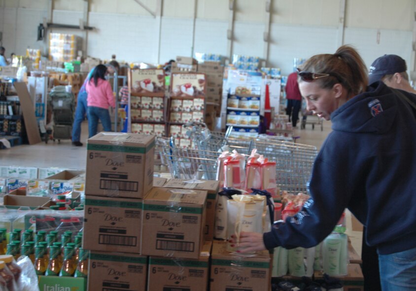 Military members, retirees and dependents take advantage of savings at the case lot sale at Dobbins Air Reserve Base Nov. 7. The Defense Commissary Agency holds periodical case lot sale events, offering customers bulk quantities of their favorite products at increased savings, such as canned goods, beverages, cleaning or laundry products, meat and produce. The next case lot sale is scheduled for Feb. 5-7, 2010. (U.S. Air Force photo/Tech. Sgt. James Branch)