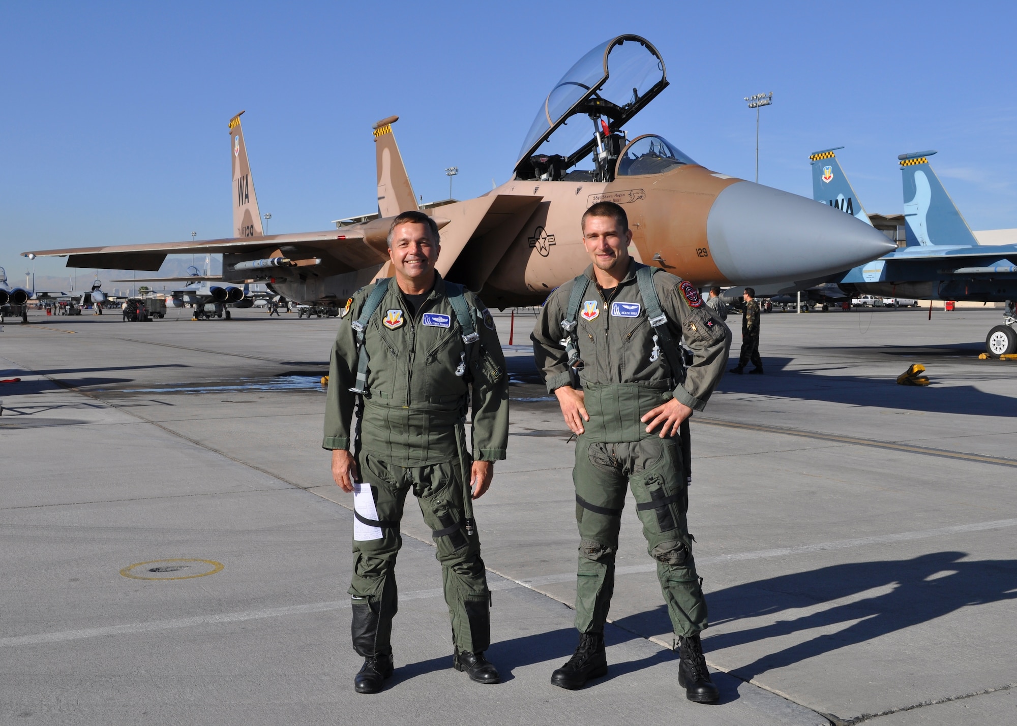 Supercross racer Heath Voss (right) flew in an Air Force F-15 fighter jet in an hour long orientation ride over the Nevada Test and Training Range at Nellis Air Force Base, Nev., with Air National Guard pilot Col. Terrence Fornof (left), Oct. 8. (U.S. Air Force photo/Tech. Sgt. Wendy C. Yada)