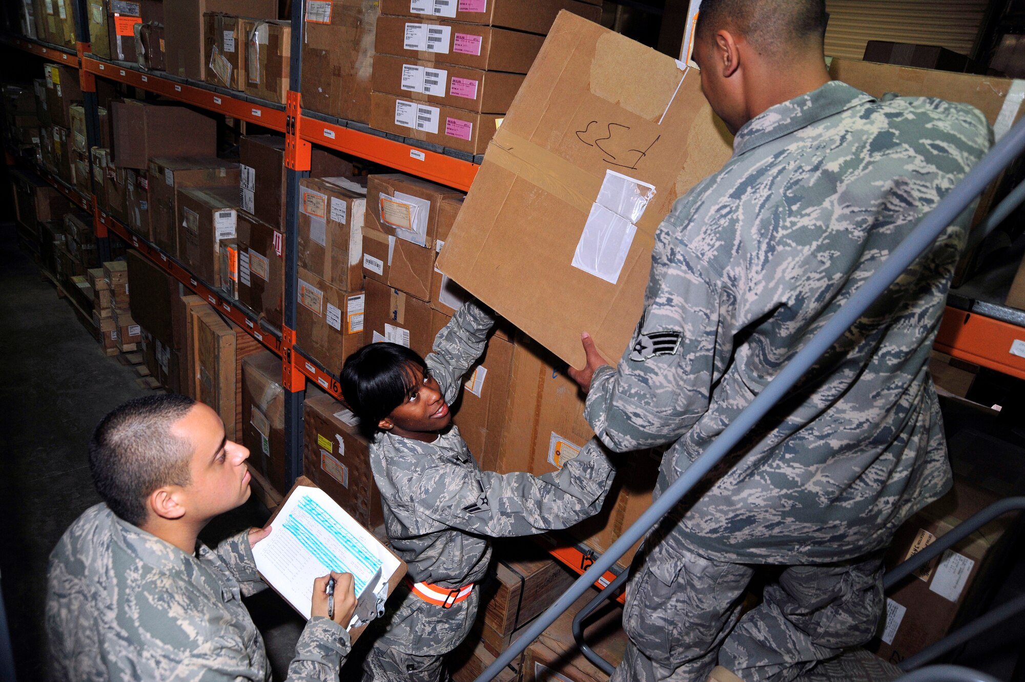 SOUTHWEST ASIA -Senior Airman Jose Barba, Airman 1st Class Erica Franks and Senior Airman Dharamdeo Behari, 380th Expeditionary Logistic Readiness Squadron flightline supply, restock the warehouse shelves with newly arrived items Nov. 7, 2009. Airman Barba is deployed from Tinker Air Force Base, Okla., and hails from Santa Ana, Calif. Airman Franks is deployed from Nellis Air Force Base, Nev., and hails from Port Huron, Mich. Airman Behari is deployed from Naval Air Station Joint Reserve Base Willow Grove, Pa., and hails from Philadelphia, Pa. (U.S. Air Force photo/Tech. Sgt. Charles Larkin Sr)