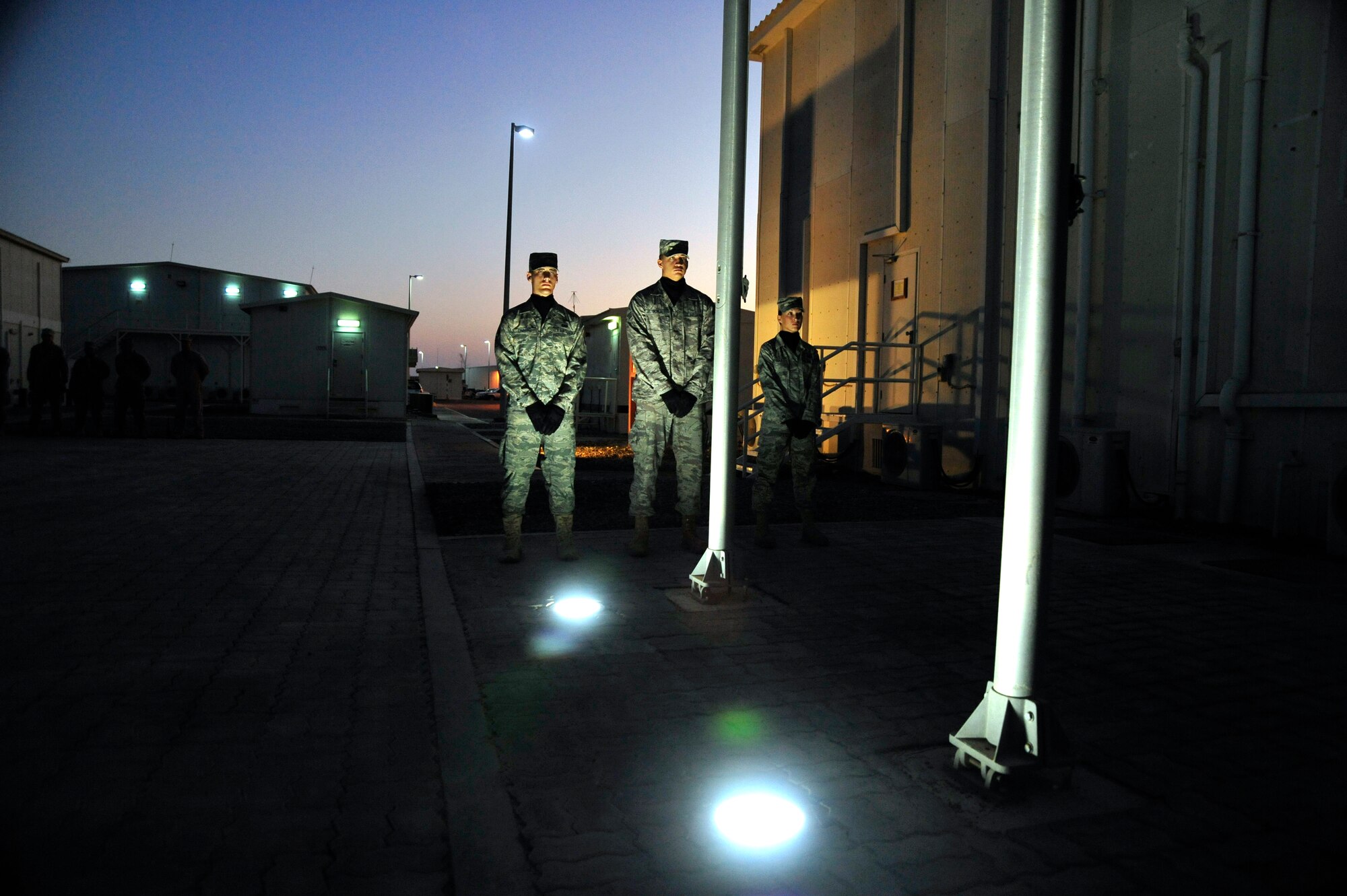 SOUTHWEST ASIA - Members of the 380th Air Expeditionary Wing Honor Guard stand at parade rest before a Retreat ceremony Nov. 6, 2009. The 380th AEW Honor Guard provides time-honored customs and courtesies for official ceremonies. (U.S. Air Force photo/Senior Airman Stephen Linch)
