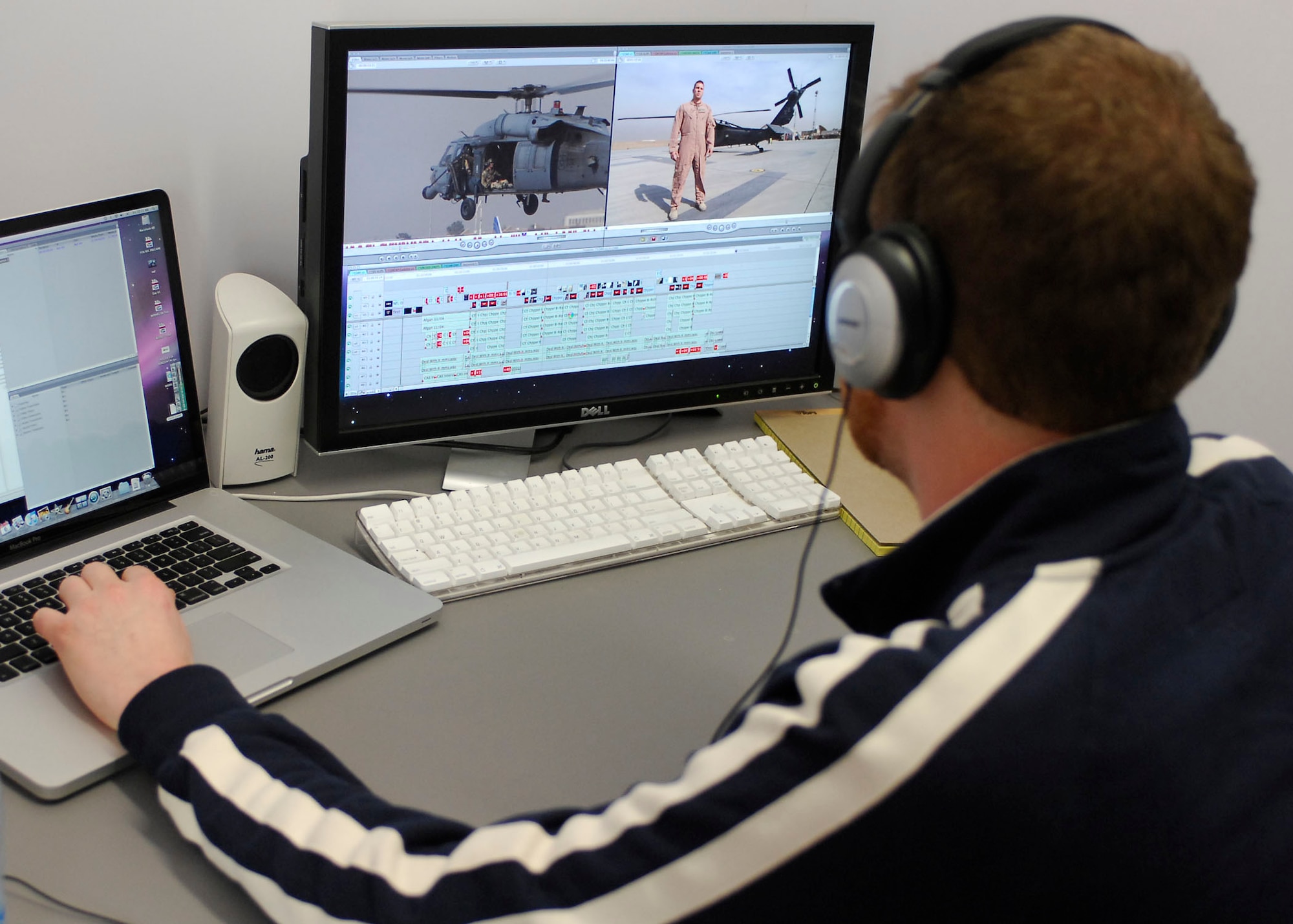 BAGRAM AIR FIELD, Afghanistan -- Ryan Little, editor for Fox Sports, edits video footage to use as small clips throughout the Sunday show Nov. 6, 2009.   The "Fox NFL Sunday" team is scheduled to broadcast live Nov. 8, 2009 from here.  Mr. Hill hails from Los Angeles, and Mr. Noble hails from White Plains, N.Y.  Mr. Little hails from Boston.  (U.S. Air Force photo/Senior Airman Felicia Juenke)