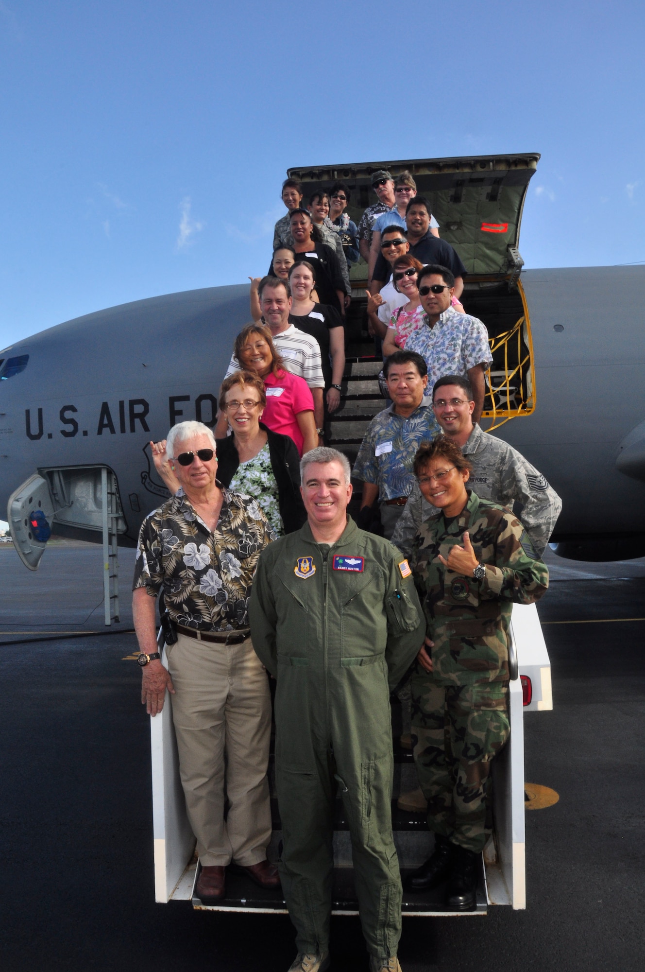 Col. Robert “Randy” Huston, 624th Regional Support Group commander, leads a contingent of Reservists and their employers for the Group’s first-ever Employer Support Flight at Hickam Air Force Base, Hawaii Nov. 8. The event, held in co-operation with the Hawaii Committee of Employer Support for the Guard and Reserve, helped employers better understand the time and sacrifice their employees invest in their role as Air Force Reservists. Civilian bosses of Group Reservists flew aboard an Air Force Reserve KC-135 Stratotanker and witnessed an in-flight refueling of Hawaii Air National Guard F-15 Eagles. The KC-135 used for Saturday's Employer Support Flight is assigned to the 452nd Air Mobility Wing at March Air Reserve Base, Calif. (Air Force photo/Master Sgt. Daniel Nathaniel)