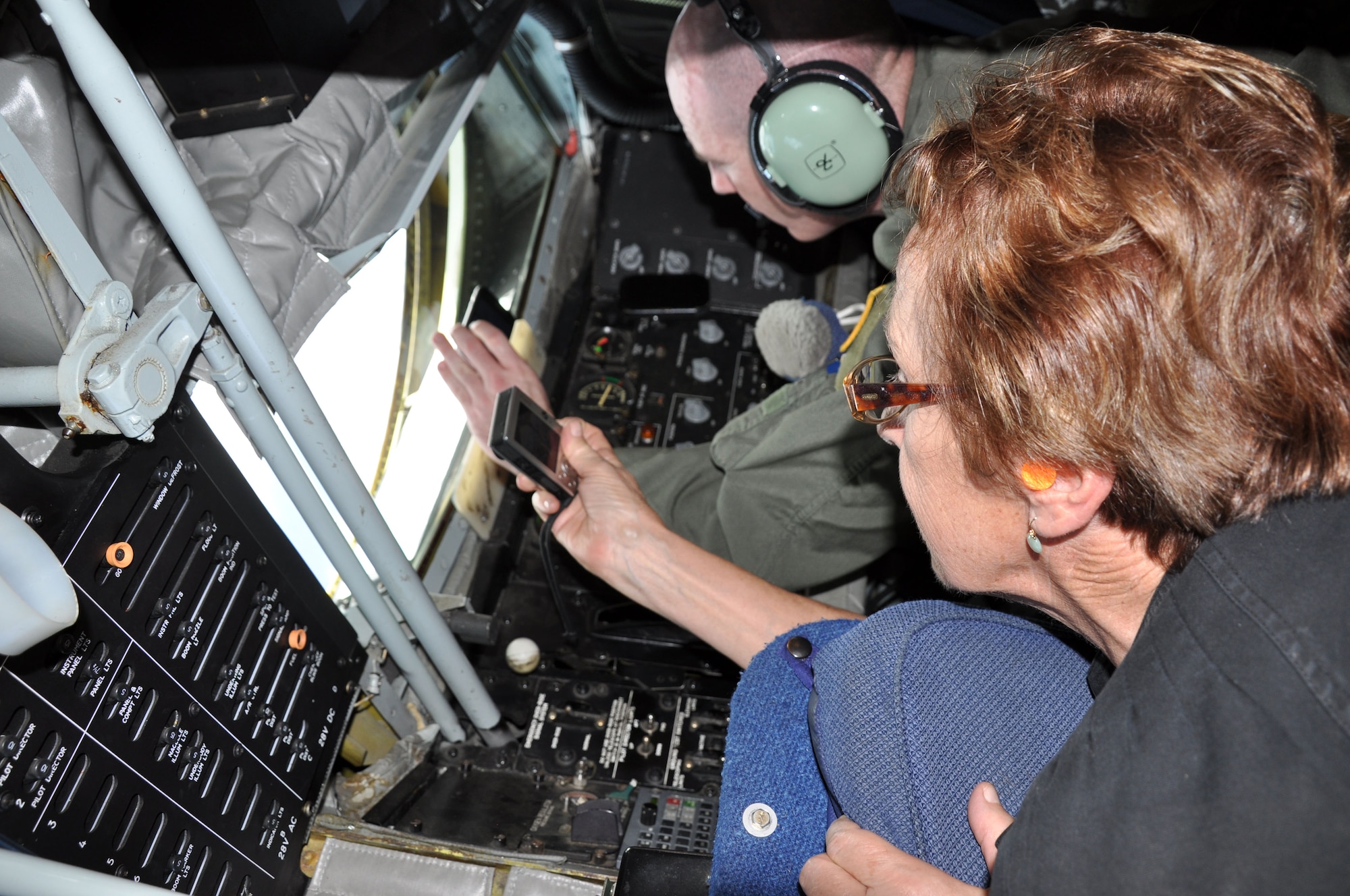 The Honorable Marilyn Lee, Hawaii State House of Representatives, watches as Senior Master Sgt. Ray Lewis, boom operator of a KC-135 Stratotanker, refuels a Hawaii Air National Guard F-15 Eagle over the Hawaiian Islands Nov. 7 as a part of the 624th Regional Support Group’s first-ever Employer Support Flight at Hickam Air Force Base, Hawaii. The event, held in co-operation with the Hawaii Committee of the Employer Support for the Guard and Reserve, helped employers better understand the time and sacrifice their employees invest in their role as Air Force Reservists. The KC-135 used for Saturday's Employer Support Flight is assigned to the 452nd Air Mobility Wing at March Air Reserve Base, Calif. (Air Force photo/Staff Sgt. Erin Smith)