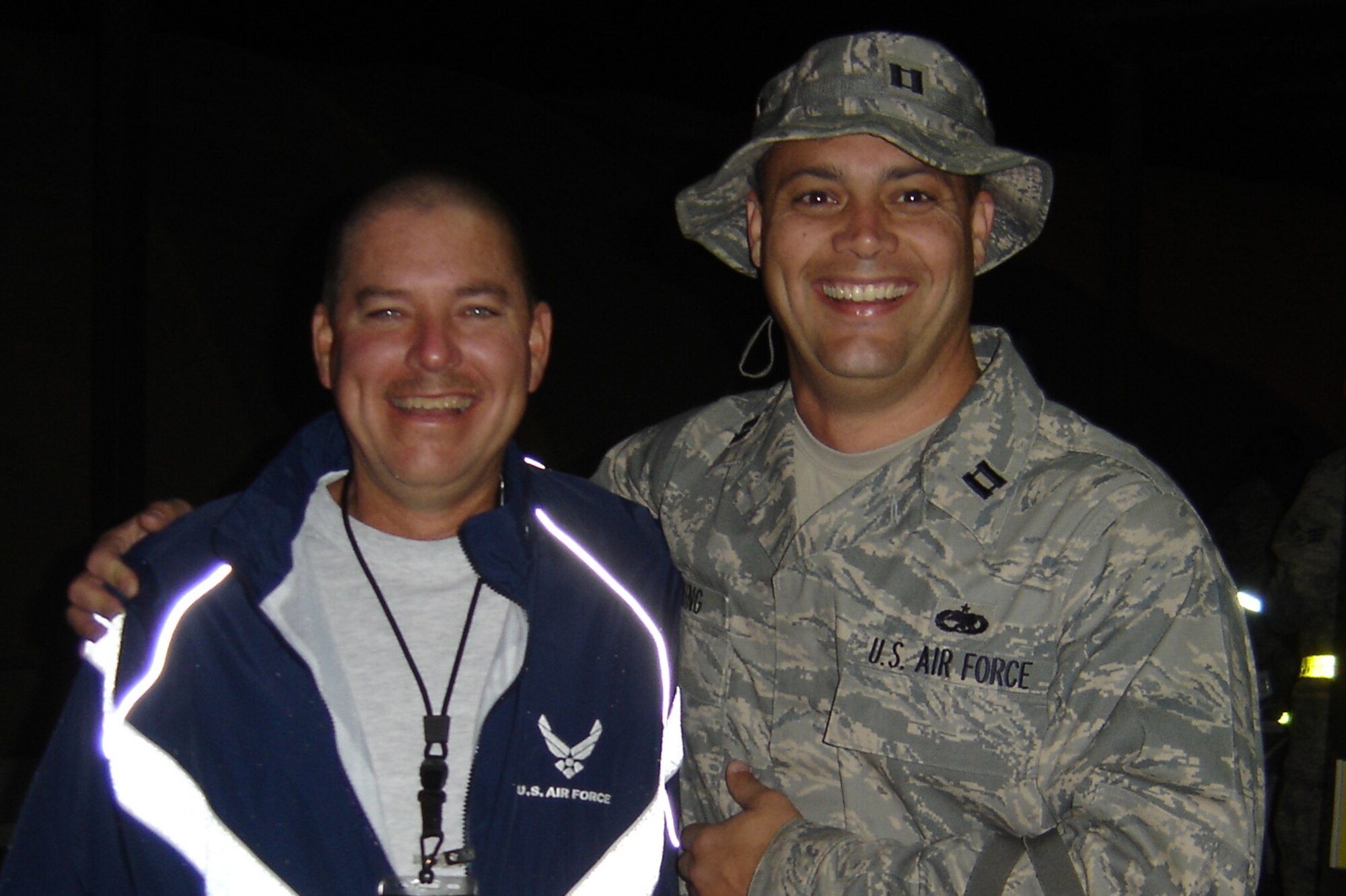 Capt. Steve Young catches up with Chief Master Sgt. Dave Jackson while at Manas Air Base, Kyrgyzstan. Both are reservists with the 916th Maintenance Group, but are deployed to Afghanistan. Capt. Young is the officer in charge of the C-17 maintenance team in Kandahar and Chief Jackson is working in Kabul.