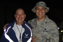 Capt. Steve Young catches up with Chief Master Sgt. Dave Jackson while at Manas Air Base, Kyrgyzstan. Both are reservists with the 916th Maintenance Group, but are deployed to Afghanistan. Capt. Young is the officer in charge of the C-17 maintenance team in Kandahar and Chief Jackson is working in Kabul.