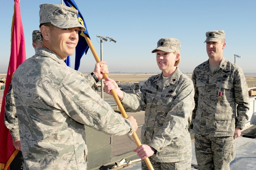 SEYMOUR JOHNSON AIR FORCE BASE, N.C. -- Lt. Col. Ann Brown (center) takes command of the 376th Expeditionary Logistics Readiness Squadron at Manas Air Base, Kyrgyzstan in late October. Colonel Brown, a Reservist with the 916th Air Refueling Wing, is deployed for six months.