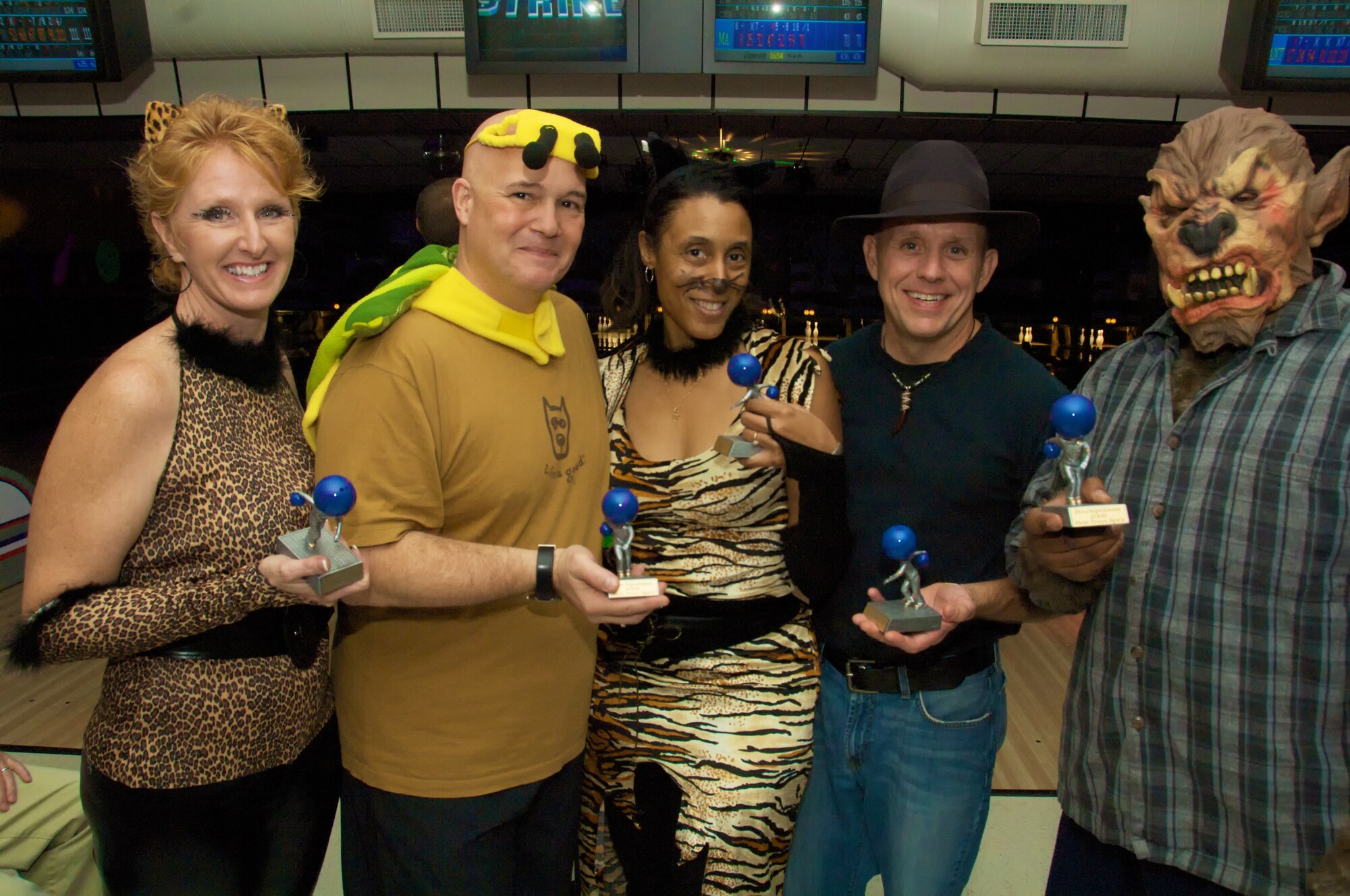 KEESLER AIR FORCE BASE, Miss. -- Twenty-two teams from various units throughout the 403rd Wing participated in Bowlapalooza here during the November Unit Training Assembly. Several members displayed their team spirit by decking themselves out in different costumes for the event. Bowlers from the 403rd Areomedical Staging Squadron, or the ?Vet Clinic? as they called themselves, won the Best Team Spirit Award. Shown here from left to right are Master Sgt. Tammy Campell, Maj. Christopher Alexander, Maj. Marla Stewart, Capt. Andrew Belcher, and Staff Sgt. Dwayne Buchanan.  (U.S. Air Force photo by Tech. Sgt. Ryan Labadens)