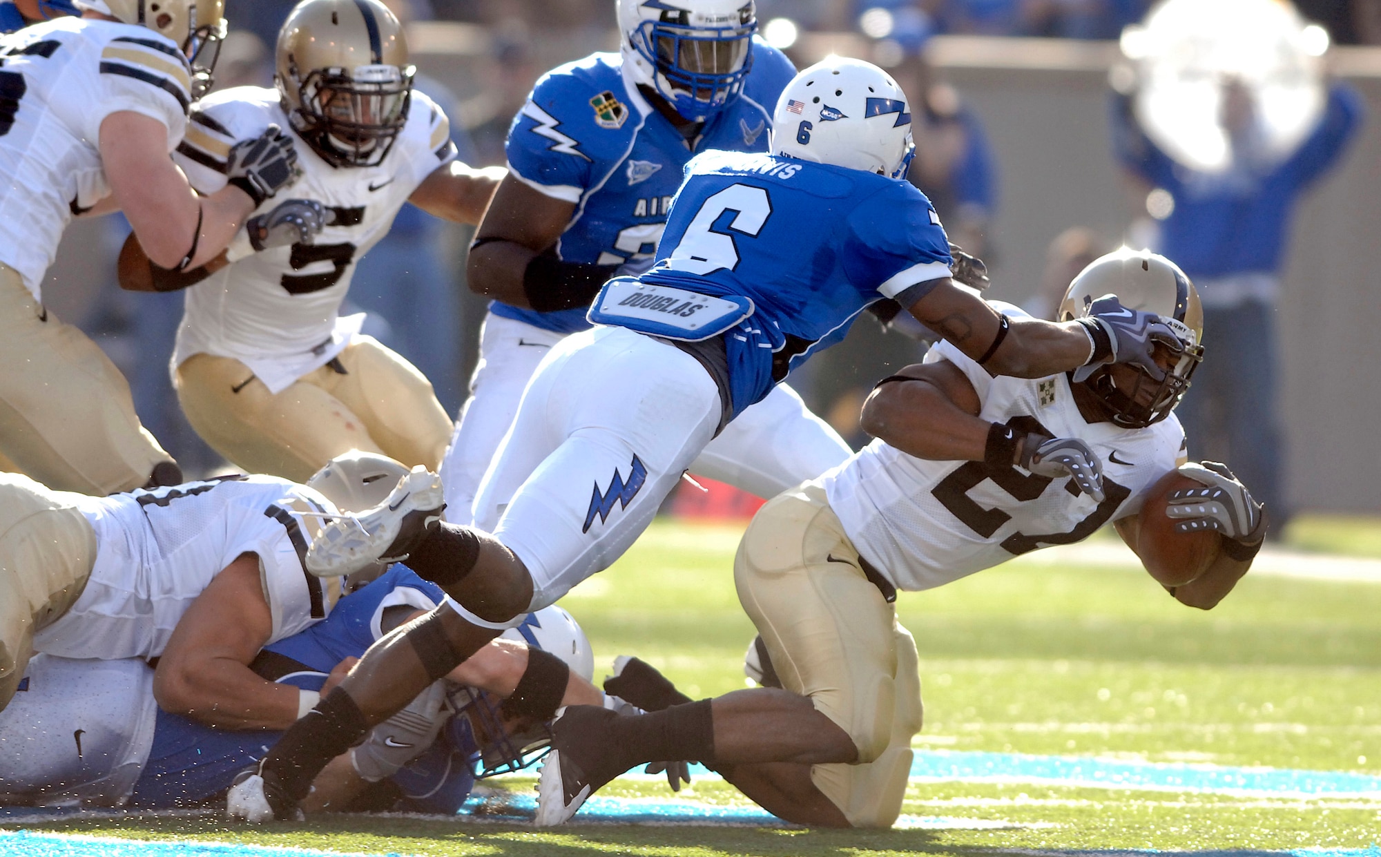 Falcons defensive back Jon Davis stops Black Knights fullback Kingsley Ehie during the Air Force-Army game at Falcon Stadium Nov. 7, 2009. Davis, a sophomore and native of Cincinnati, had five tackles in Air Force's 35-7 victory over the Black Knights. (U.S. Air Force photo/Mike Kaplan)