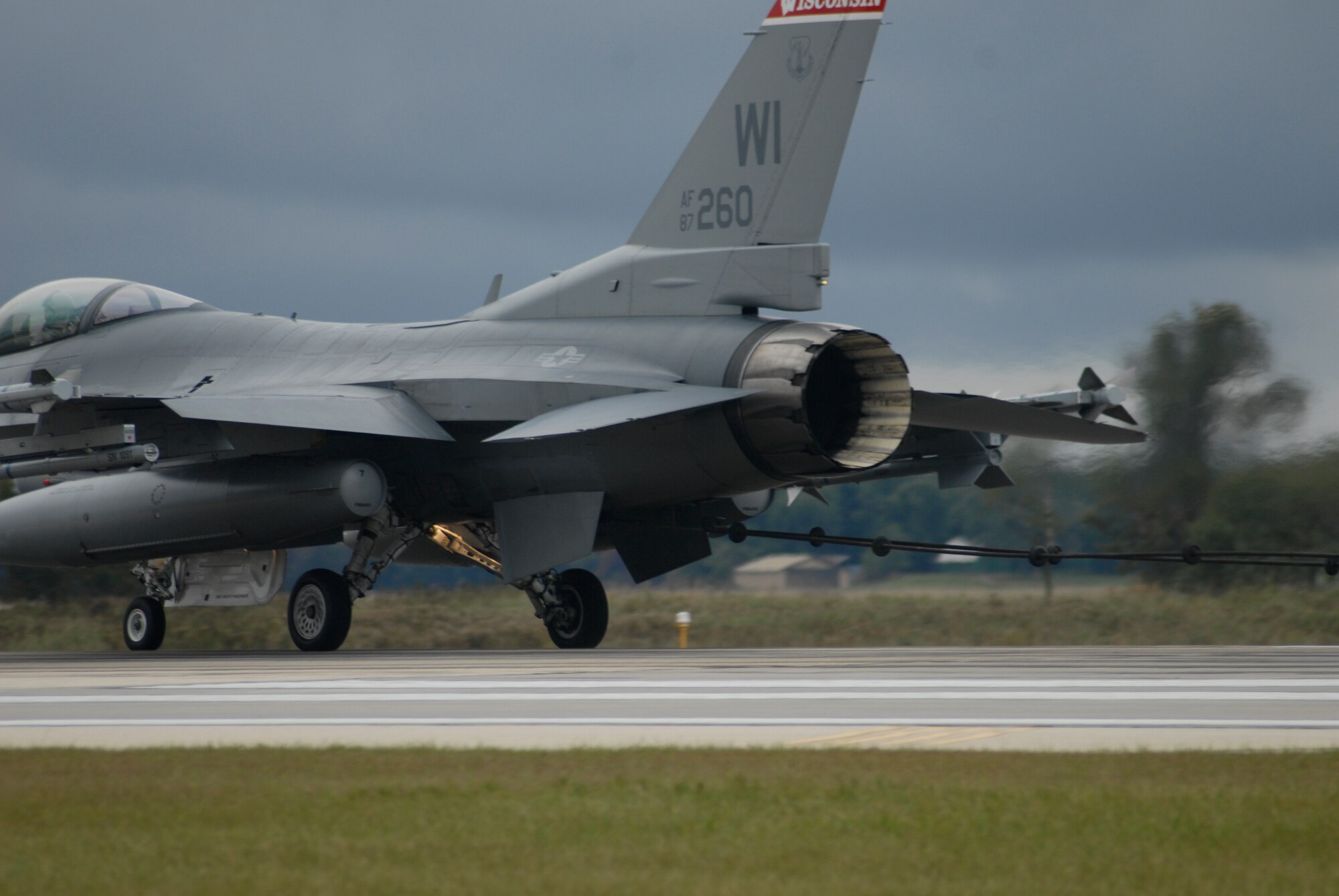 With a weight of 29,000 lbs. and at a speed of almost 110 MPH, Lt. Col. Nick Radney, a pilot with the115th Fighter Wing in Madison, Wis., brings an F-16 Fighting Falcon  safely to a stop after a test of the Barrier Arresting Kit 12, a system designed to be "hooked" by an aircraft if needed to stop the aircraft.  
