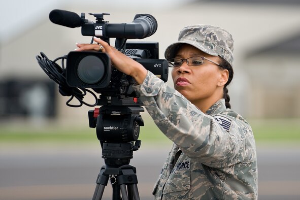 Master Sgt. Michelle Thomas captures video footage on location at Dover Air Force Base, Del. Aug. 28, 2009.  Master Sgt. Thomas is deployed there to fill a critical staffing gap for the active-duty forces in the Air Force Mortuary Affairs Operations Center.  (Photo courtesy of Tech. Sgt. Megan Hunter)