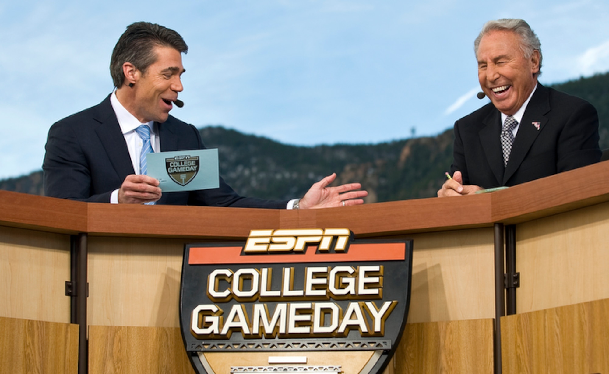 Chris Fowler (left) and Lee Corso, two of ESPN's "College GameDay" broadcasters joke during a live broadcast from the U.S. Air Force Academy Nov. 7 before the Air Force vs. Army football game in Colorado Springs, Colo. The latest Academy visit is part of ESPN's salute to veterans of the U.S. armed forces. (U.S. Air Force photo/Staff Sgt. Bennie J. Davis III)