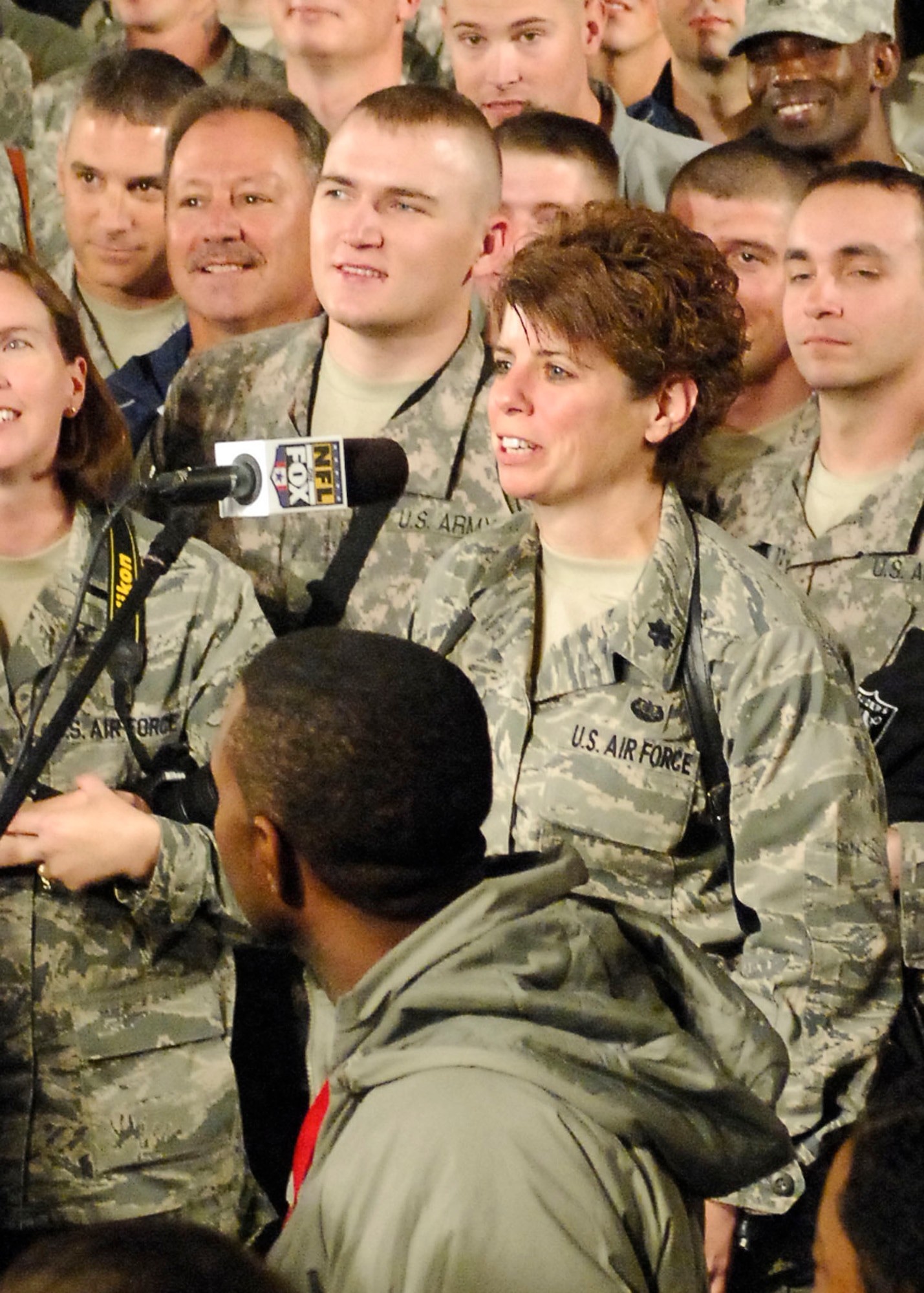 BAGRAM AIR FIELD, Afghanistan -- Lt. Col. Wendy Sherman, staff judge advocate from the 455th Air Expeditionary Wing, asks a question to Jay Glazer during the pregame Nov. 7, 2009. The "Fox NFL Sunday" team came to visit Bagram to boost morale.  They are scheduled to broadcast live Nov. 8, 2009 from here.  Colonel Sherman is deployed from Hickam Air Force Base, Hawaii and hails from Enfield, Conn.  (U.S. Air Force photo/Senior Airman Felicia Juenke)