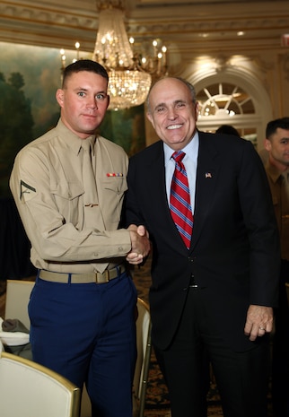 NEW YORK -- Marines from Special Purpose Marine Air Ground Task Force 26 pose with Rudy Giuliani, former New York City mayor and presidential candidate, during a Nov. 8 brunch at the Jumeriah Essex House in honor of the USS New York sailors and Special Purpose Marine Air Ground Task Force 26 Marines who embarked on the ship for her commissioning ceremony Nov. 11.