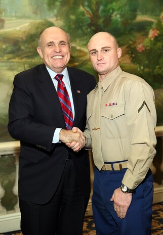 NEW YORK -- Marines from Special Purpose Marine Air Ground Task Force 26 pose with Rudy Giuliani, former New York City mayor and presidential candidate, during a Nov. 8 brunch at the Jumeriah Essex House in honor of the USS New York sailors and Special Purpose Marine Air Ground Task Force 26 Marines who embarked on the ship for her commissioning ceremony Nov. 11.