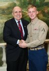NEW YORK -- Marines from Special Purpose Marine Air Ground Task Force 26 pose with Rudy Giuliani, former New York City mayor and presidential candidate, during a Nov. 8 brunch at the Jumeriah Essex House in honor of the USS New York sailors and Special Purpose Marine Air Ground Task Force 26 Marines who embarked on the ship for her commissioning ceremony Nov. 11.