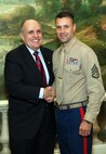 NEW YORK -- Marines from Special Purpose Marine Air Ground Task Force 26 pose with Rudy Giuliani, former New York City mayor and presidential candidate, during a Nov. 8 brunch at the Jumeriah Essex House in honor of the USS New York sailors and Special Purpose Marine Air Ground Task Force 26 Marines who embarked on the ship for her commissioning ceremony Nov. 11.
