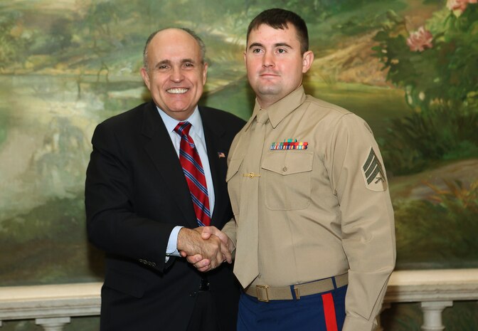NEW YORK -- Marines from Special Purpose Marine Air Ground Task Force 26 pose with Rudy Giuliani, former New York City mayor and presidential candidate, during a Nov. 8 brunch at the Jumeriah Essex House in honor of the USS New York sailors and Special Purpose Marine Air Ground Task Force 26 Marines who embarked on the ship for her commissioning ceremony Nov. 11.
