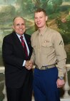 NEW YORK -- Marines from Special Purpose Marine Air Ground Task Force 26 pose with Rudy Giuliani, former New York City mayor and presidential candidate, during a Nov. 8 brunch at the Jumeriah Essex House in honor of the USS New York sailors and Special Purpose Marine Air Ground Task Force 26 Marines who embarked on the ship for her commissioning ceremony Nov. 11.