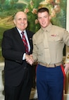 NEW YORK -- Marines from Special Purpose Marine Air Ground Task Force 26 pose with Rudy Giuliani, former New York City mayor and presidential candidate, during a Nov. 8 brunch at the Jumeriah Essex House in honor of the USS New York sailors and Special Purpose Marine Air Ground Task Force 26 Marines who embarked on the ship for her commissioning ceremony Nov. 11.