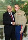 NEW YORK -- Marines from Special Purpose Marine Air Ground Task Force 26 pose with Rudy Giuliani, former New York City mayor and presidential candidate, during a Nov. 8 brunch at the Jumeriah Essex House in honor of the USS New York sailors and Special Purpose Marine Air Ground Task Force 26 Marines who embarked on the ship for her commissioning ceremony Nov. 11.