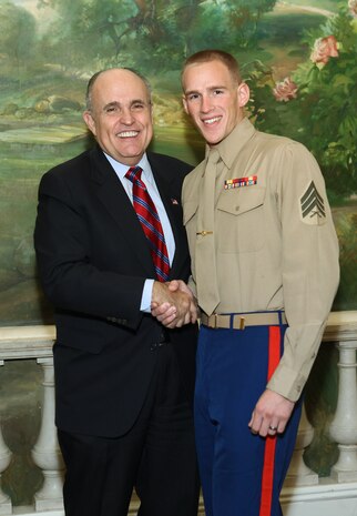 NEW YORK -- Marines from Special Purpose Marine Air Ground Task Force 26 pose with Rudy Giuliani, former New York City mayor and presidential candidate, during a Nov. 8 brunch at the Jumeriah Essex House in honor of the USS New York sailors and Special Purpose Marine Air Ground Task Force 26 Marines who embarked on the ship for her commissioning ceremony Nov. 11.
