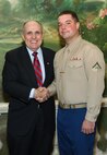 NEW YORK -- Marines from Special Purpose Marine Air Ground Task Force 26 pose with Rudy Giuliani, former New York City mayor and presidential candidate, during a Nov. 8 brunch at the Jumeriah Essex House in honor of the USS New York sailors and Special Purpose Marine Air Ground Task Force 26 Marines who embarked on the ship for her commissioning ceremony Nov. 11.