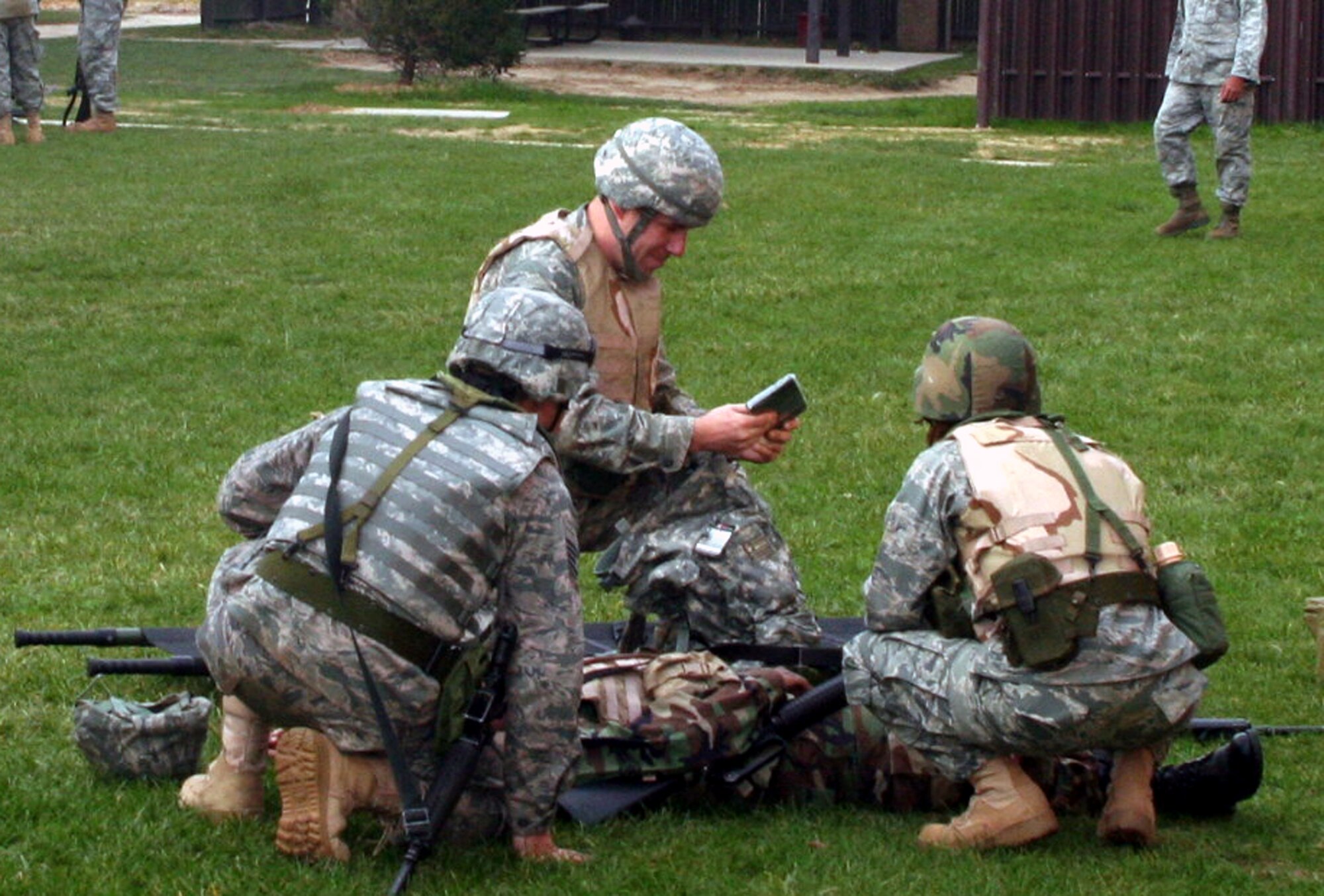 Students in the Combat Airman Skills Training Course participate in a training session of the Care Under Fire (combat first aid) class on Nov. 9, 2009, at the U.S. Air Force Expeditionary Center at Joint Base McGuire-Dix-Lakehurst, N.J.  The class, taught by the Expeditionary Center's 421st Combat Training Squadron, focuses on combat lifesaver skills.  The CAST course trains Airmen for upcoming deployments.  (U.S. Air Force Photo/Tech. Sgt. Scott T. Sturkol)