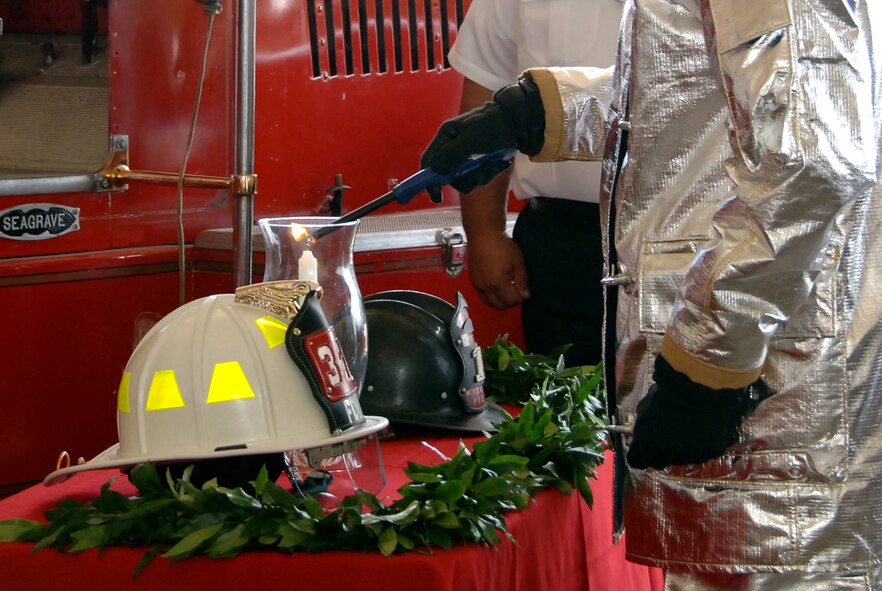 HICKAM AIR FORCE BASE, HawaiiI – In memory of fallen firefighters, a candle is lit and a moment of silence is observed during the Hickam Fire Department’s 70th Anniversary Ceremony to celebrate the department’s establishment at Hickam Air Force Base Nov. 6. (U.S. Air Force photo/Vanessa M. Forloine)  