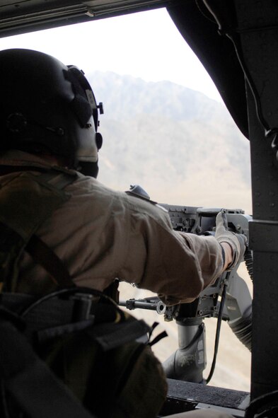 An aerial gunner from the 33rd Expeditionary Rescue Squadron participates in a flight mission on an HH-60 Pave Hawk helicopter at a forward operating base in Afghanistan. The 33rd ERQS continues combat flight operations in Afghanistan during their six-month deployment to Operation Enduring Freedom from Kadena. (Courtesy photo)