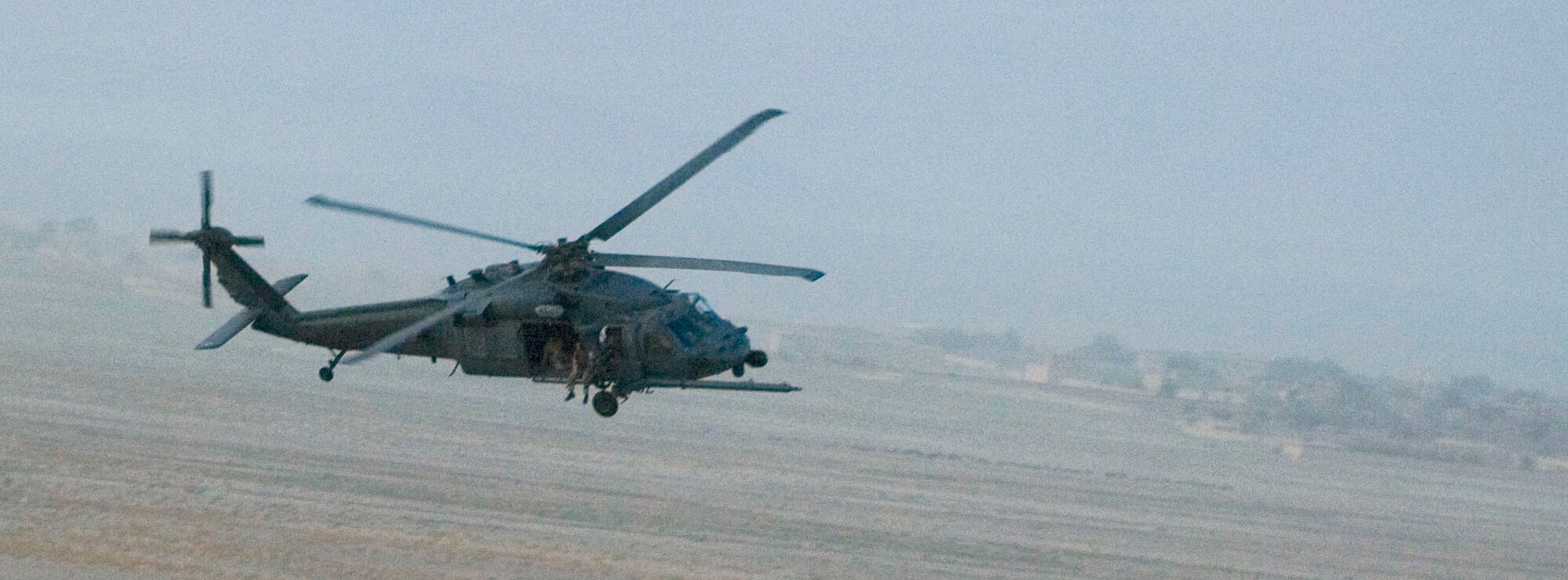 Airmen from the 33rd Expeditionary Rescue Squadron conduct a mission
aboard an HH-60 Pave Hawk helicopter at a forward operating base in Afghanistan.
The 33rd ERSQ continues combat flight operations in Afghanistan during their
six-month deployment to Operation Enduring Freedom from Kadena. (Courtesy photo)
