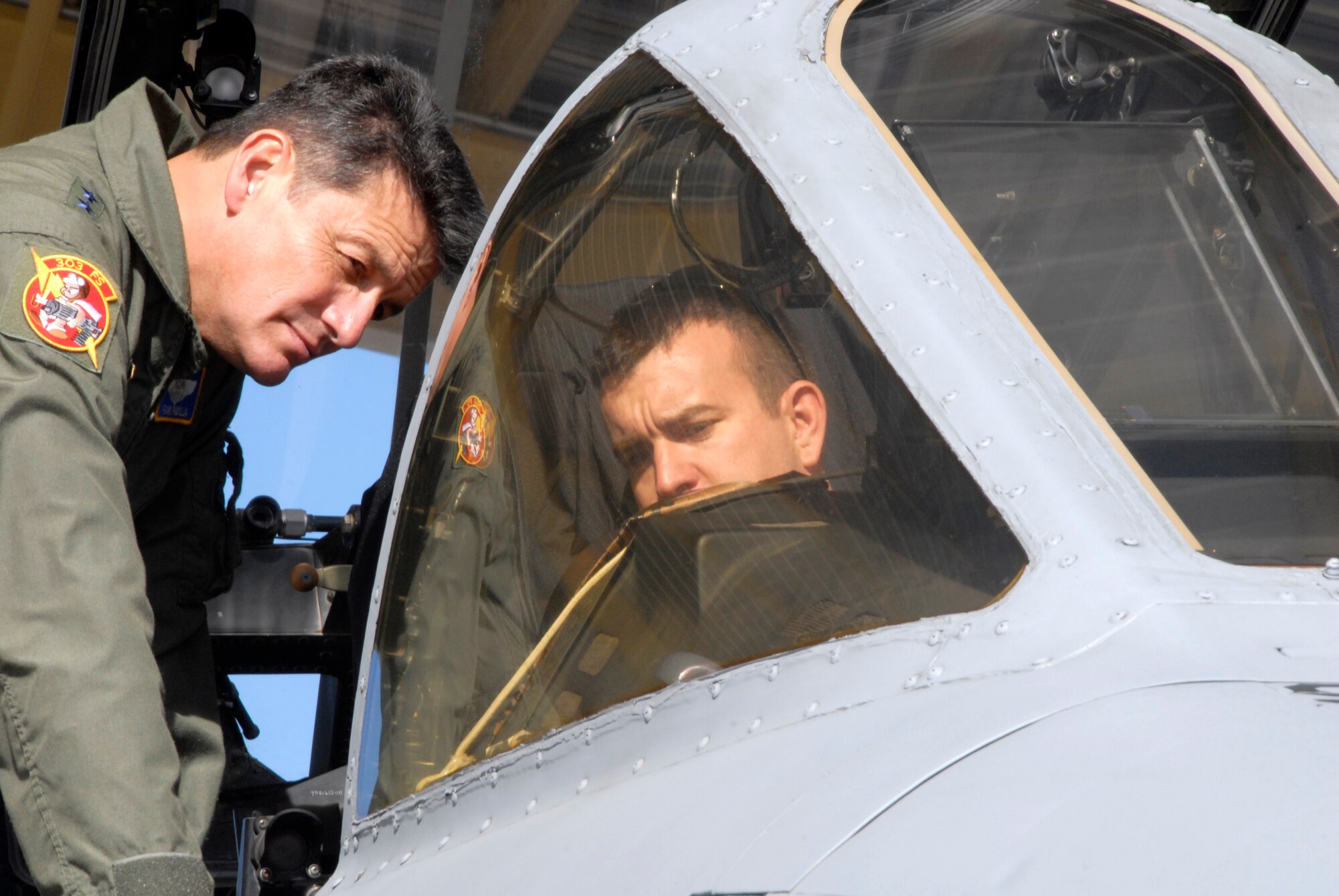 Maj. Gen. Frank Padilla, left, learns about the A-10 Thunderbolt II's smart-color-mulit-function display from Capt. Chad Carlton, an A-10 pilot in the 303rd Fighter Squadron.  General Padilla is the commander of 10th Air Force and he visited the 442nd Fighter Wing Nov. 6 to 8 at Whiteman Air Force Base, Mo.  The 442nd is an Air Force Reserve unit based at Whiteman.  The wing's mission is to operate, maintain and support a squadron of A-10 aircraft.  (U.S. Air Force photo/Maj. David Kurle)