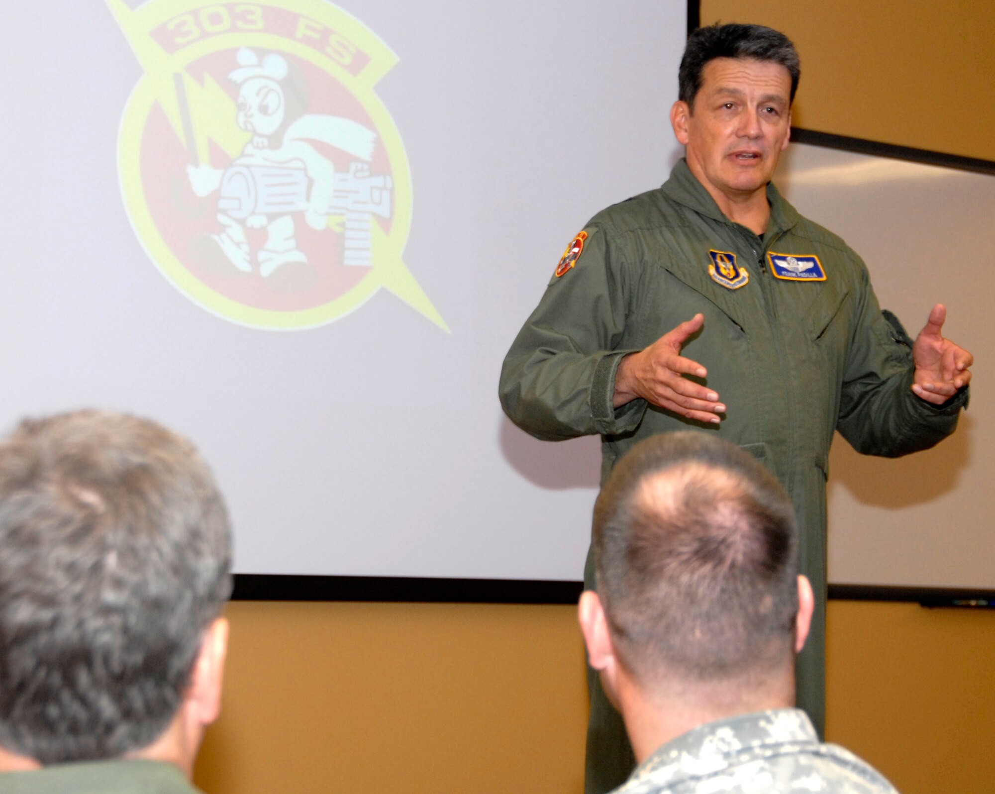 Maj. Gen. Frank Padilla talks about the accomplishments of the 303rd Fighter Squadron during a ribbon-cutting ceremony on the squadron's new operations building Nov. 7, at Whiteman Air Force Base, Mo.  Maj. Gen. Padilla is the commander of 10th Air Force, part of Air Force Reserve Command.  The 303rd is part of the 442nd Fighter wing, which is an Air Force Reserve unit based at Whiteman.  (U.S. Air Force photo/Maj. David Kurle)