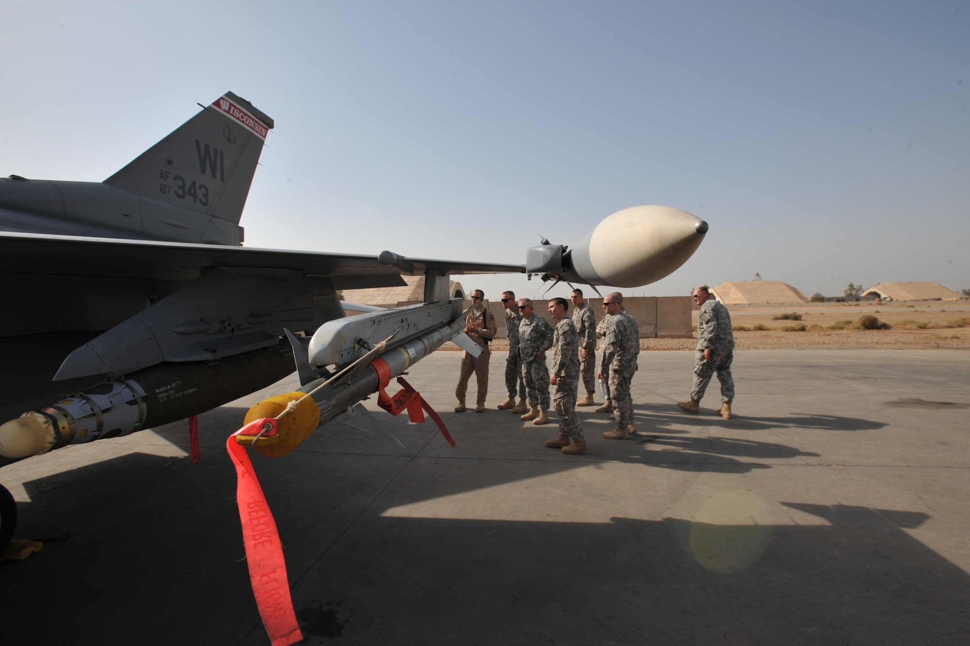 Wisconsin Army National Guard Soldiers of the 32nd Infantry Brigade Combat Team look over one of the Wisconsin Air National Guard's F-16 fighters at an air base in Iraq. (U.S. Army photo by Spc. Tyler Lasure)