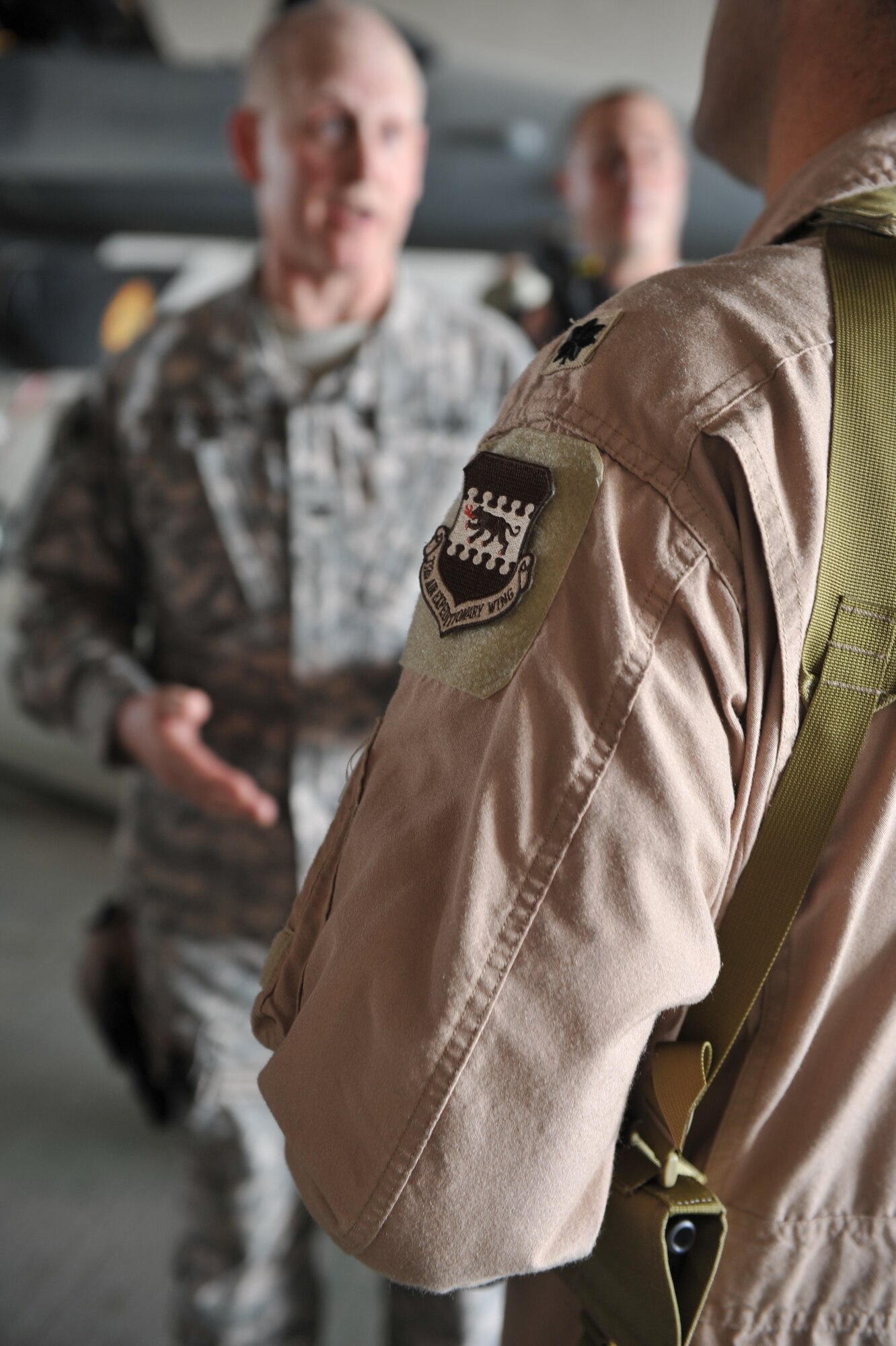 Col. Steven Bensend (left) talks with Lt. Col. Erik Peterson at an air base in Iraq. Bensend commands 3,200 Wisconsin Army Guard Soldiers on the ground, while Peterson commands about 300 Wisconsin Air Guard troops providing air support. (U.S. Army photo by Spc. Tyler Lasure)