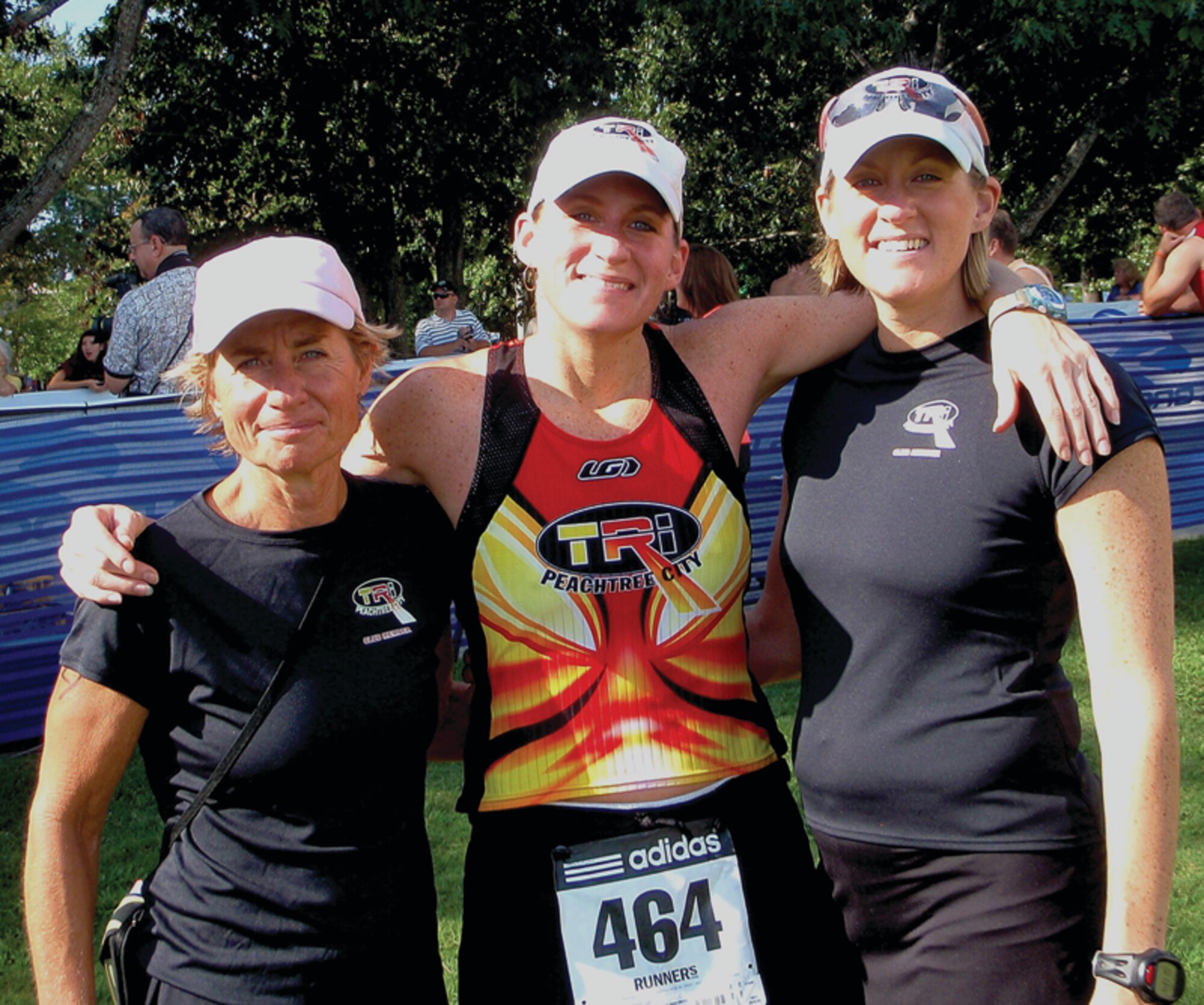 Twins Senior Airman Angela Burton, right, and Technical Sergeant Christy Henderson, middle, pose with their mother, Ann Henderson, after they won first place in the Women’s Relay Team category in the Callaway Gardens Triathlon on Sept. 6.