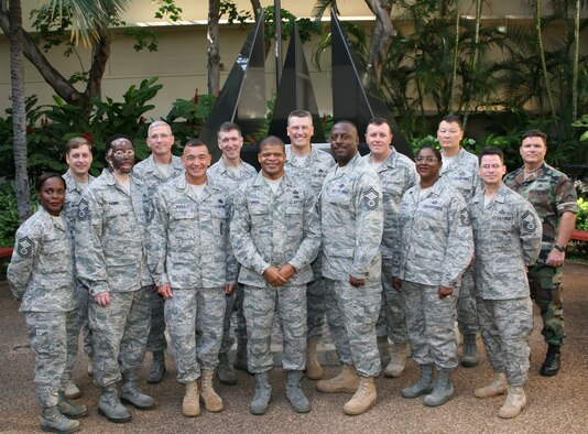 HICKAM AIR FORCE BASE, Hawaii -- Sixteen senior master sergeants were selected as the newest chief master sergeants for Team Hickam Nov. 5. On the front row from the left are: Vanessa Smallsbryant, 15th Airlift Wing; Gregory Parmer, 735th Air Mobility Squadron; Steven Poole, HQ PACAF; Willarvis Smith, Defense Information Systems Agency Pacific; David McNeal, 15th Comptrollers Squadron; Veronica Sebastion, 324th Intelligence Squadron; Raymond Irizarry, 692th Intelligence, Surveillance and Reconnaissance Group. On the back row from left to right: William Bright, Headquarters Pacific Air Forces; Guy Ingersoll, HQ PACAF; Stephen Steele, HQ PACAF; Stuart Nikolas, HQ PACAF; Todd Herman, Pacific Command; John Mizelle, HQ PACAF; Neil McCready, HQ PACAF. Not pictured are Charlie Johnson and James Clark, both from HQ PACAF. (U.S. Air Force photo/Chief Master Sgt. James Laurent)
