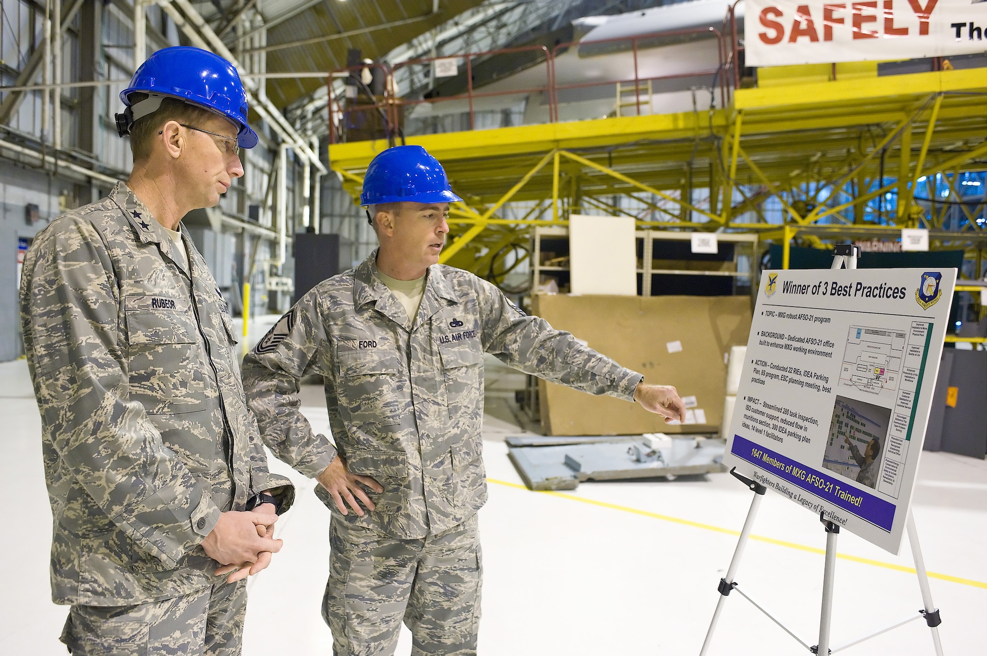 Senior Master Sgt. Bryan Ford, 512th Maintenance Squadron, briefs Maj. Gen. James T. Rubeor, 22nd Air Force commander, on Air Force Smart Operations for the 21st Century processes in the 512th Maintenance Group. AFSO 21 is designed to maximize value and minimize waste. General Rubeor visited several maintenance areas during his visit to the 512th Airlift Wing Nov. 5-8.