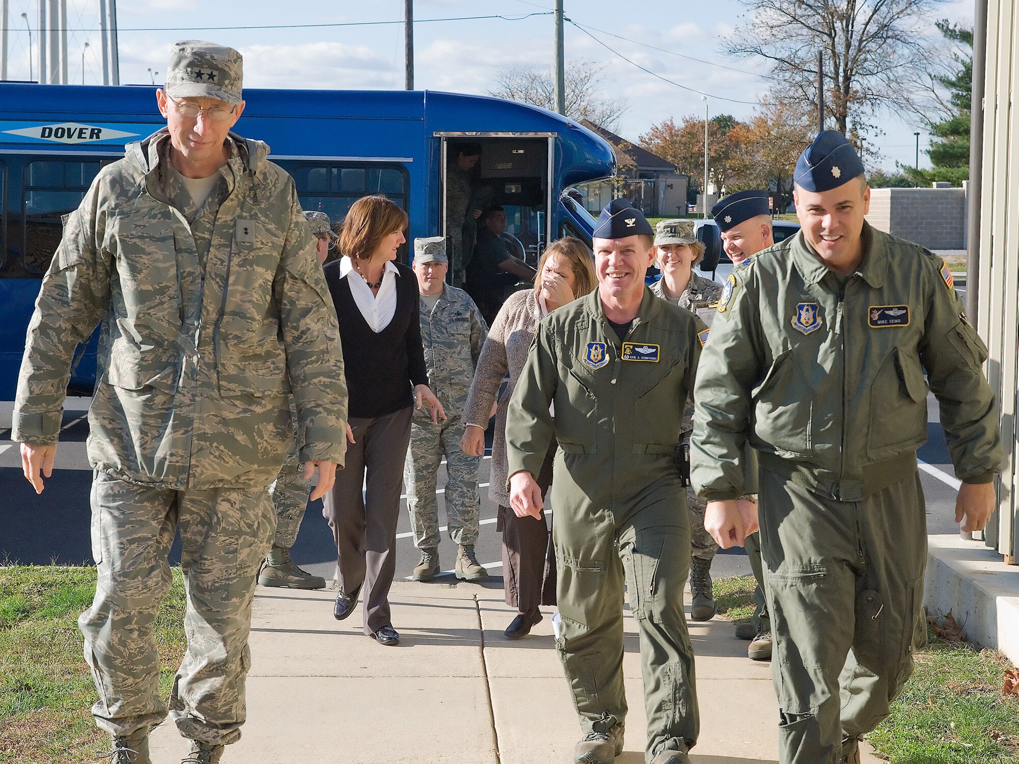 Col. Karl Schmitkons, 512th Operations Group commander, and Lt. Col. Mike Semo, C-5M Program Office chief, escort Maj. Gen. James T. Rubeor, 22nd Air Force commander, and his wife Michele, into the 512th OG. General Rubeor and his wife visited Dover Air Force Base, Del., Nov. 5-8. The 512th Airlift Wing is a subordinate unit of 22nd Air Force. General Rubeor visited the wing as part of the general?s commitment to visit all 22nd AF units to ensure Airmen have the necessary equipment, training and facilities needed to accomplish the mission. (U.S. Air Force photo/Brianne Zimny)