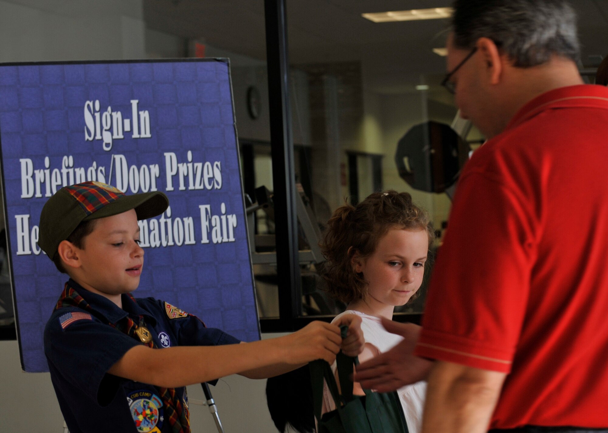 MOODY AIR FORCE BASE, Ga. -- Noah and Kira Mantz pass out information and goodie bags to retirees and their families here Nov 7. The Retiree Appreciation Week kicked off Nov. 1 and ran through Nov. 7 to thank retired military members for their service to their country. (U.S. Air Force photo by Senior Airman Schelli Jones)