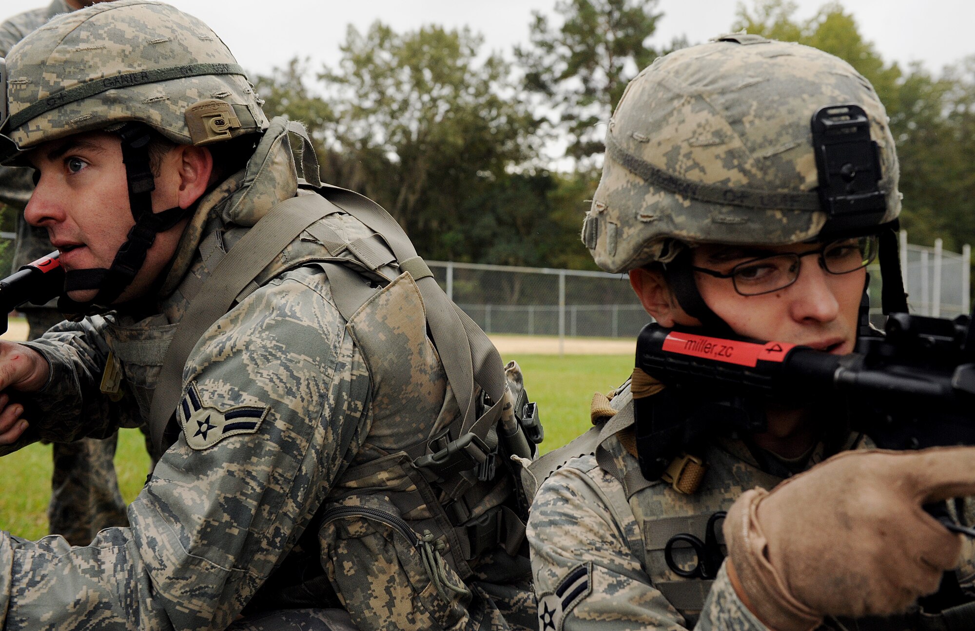 MOODY AIR FORCE BASE, Ga. -- Airmen 1st Class Christopher Ganier and Joshua Hudson, 823rd Security Forces Squadron specialists, participated in combat maneuvers designed for movement and cover here Nov. 2. These SFS members are first on the ground in a deployed environment so they exercise these maneuvers to maintain situational awareness and the highest level of readiness. (U.S. Air Force photo by Airman 1st Class Joshua Green) 