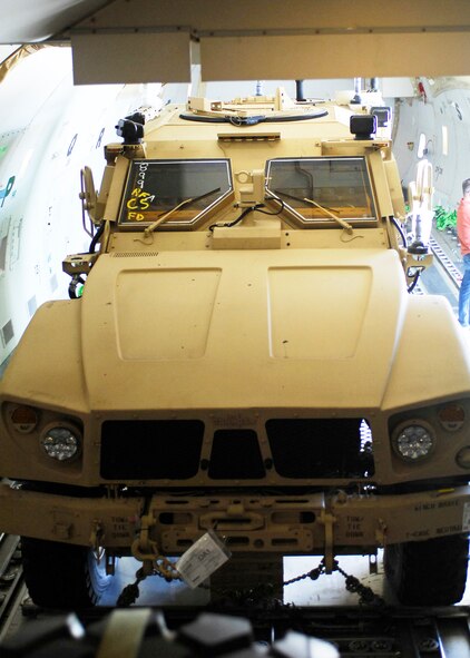A mine-resistant ambush-protected all-terrain vehicle waits to be unloaded Nov. 9, 2009, from a Boeing 747 at Bagram Airfield, Afghanistan. The M-ATVs support mounted patrols, reconnaissance, security, convoy protection, communications, command and control, and combat service support. The M-ATV is designed to replace the up-armored Humvee in Afghanistan. (U.S. Air Force photo/Senior Airman Felicia Juenke)