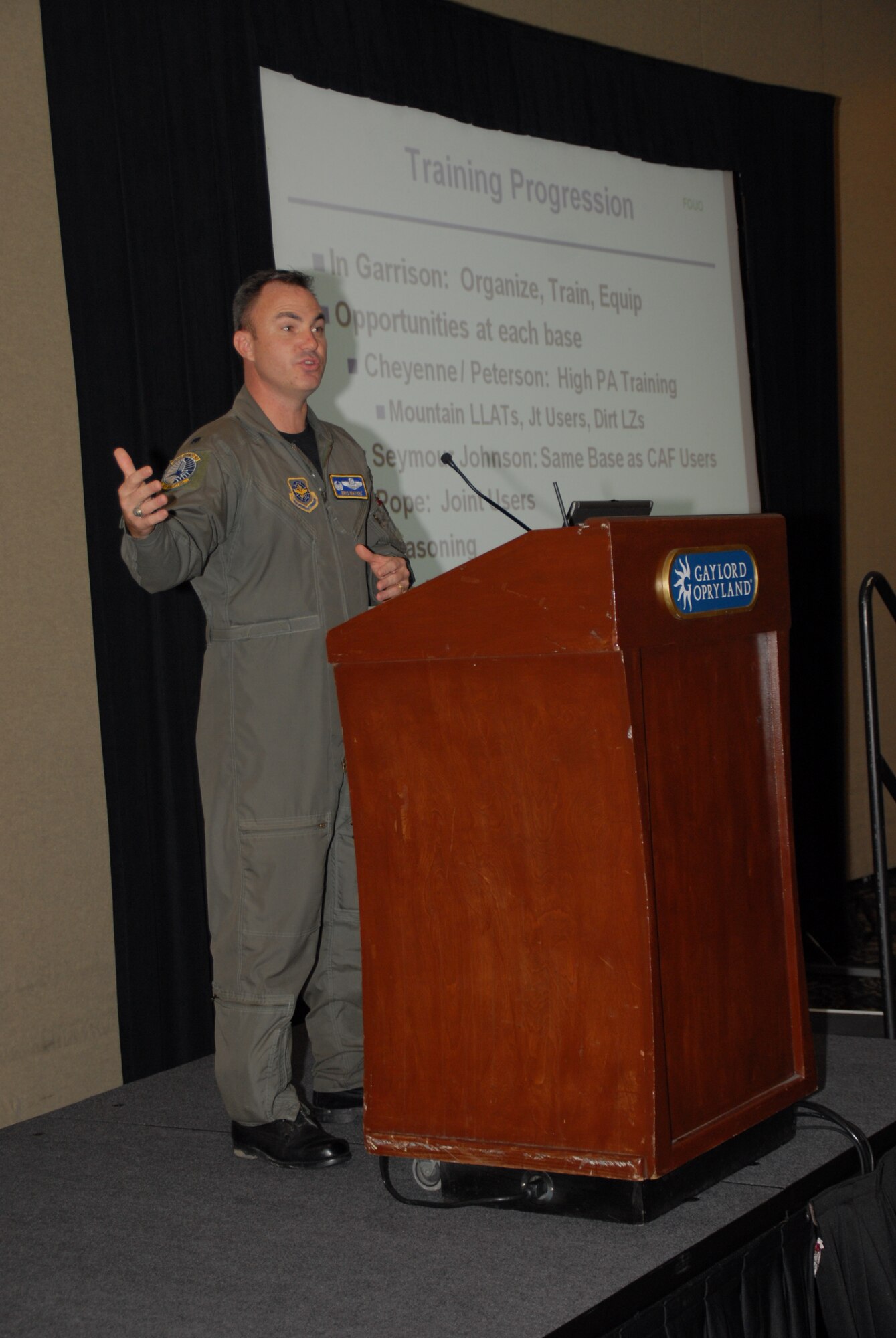 Lt. Col. Eric S. Mayheu, commander of the Wyoming Air National Guard's 30th Airlift Squadron, gives an "Establishment of Total Force Integration Units" briefing Oct. 30 during the 41st Airlift/Tanker Association convention and symposium at the Gaylord Opryland Resort and Convention Center in Nashville, Tenn.  The 30th AS is the first-ever active-associate unit, which works under the operational control of the Wyoming Air National Guard's 153rd Airlift Wing and administratively under the 19th Operations Group at Little Rock Air Force, Ark. (U.S. Air Force photo by Capt. Joe Knable)